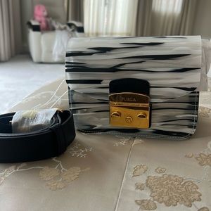 furls black and white crossbody and clutch bag